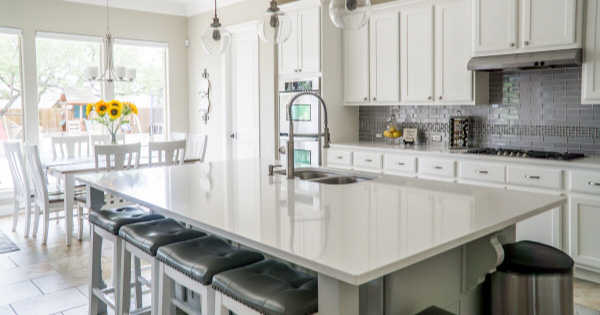 White kitchen with a new home addition dining area.